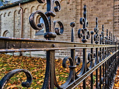 black metal fence near brown painted wall thumbnail