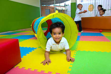 boy lying on play tunnel thumbnail