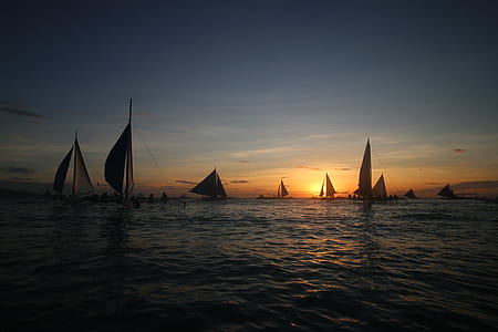 sailboat lot on body of water during nighttime thumbnail