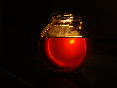 clear glass jar filled with red liquid thumbnail