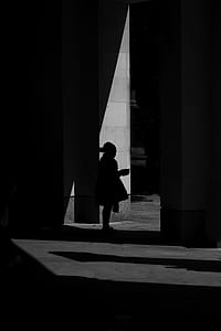 silhouette of person standing near wall thumbnail
