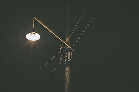 yellow street light turned on during daytime thumbnail