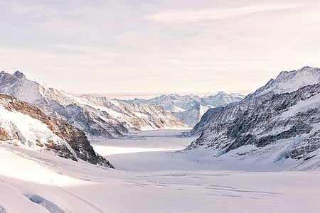 snow covered hills view during daytime thumbnail