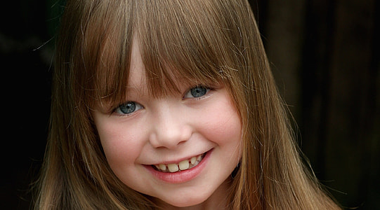 selective focus photography of smiling girl face thumbnail