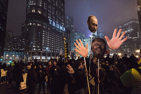 people standing near Trump building during nighttime thumbnail