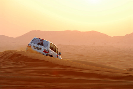 white vehicle on desert thumbnail