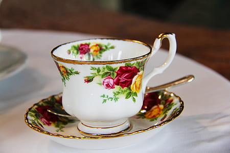 photo of white floral teacup and saucer with teaspoon thumbnail