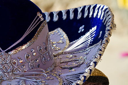 close-up photo of white and blue sequin hat thumbnail