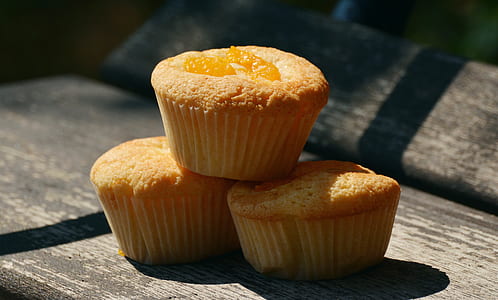 three muffins on brown surface thumbnail
