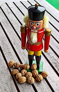 close-up photography of red nutcracker figurine thumbnail