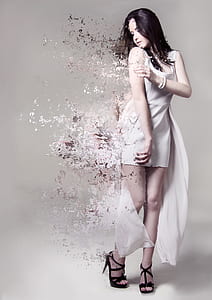 woman in white scoop-neck sleeveless high-low dress evaporating photo thumbnail