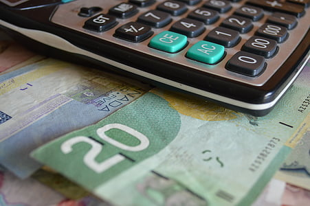 20 banknote under gray and black calculator thumbnail