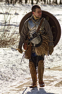 Man Wearing Armor and Walking in Snowy Field thumbnail