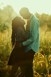 Photograph Of Man And Woman On Grass Field thumbnail