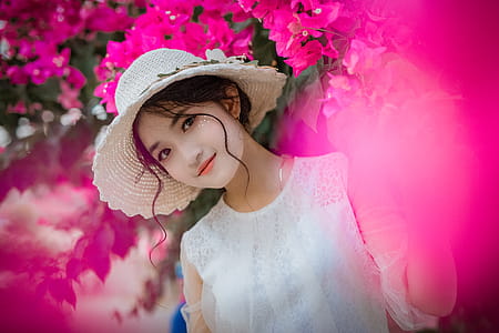 Woman Surrounded By Pink Bougainvillea Flowers thumbnail
