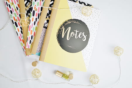 Notes book beside a string light thumbnail
