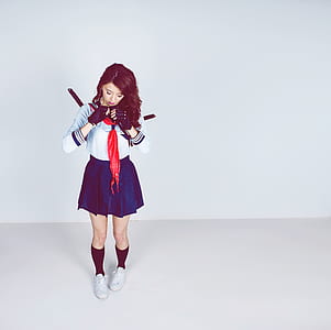 Woman Wearing School Girl Costume thumbnail