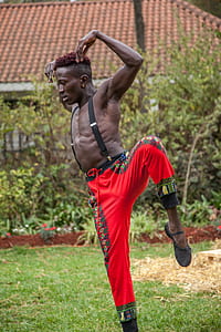 man performing dance on green grass thumbnail