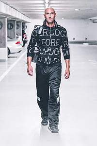 Man in Sweater and Pants Walking thumbnail