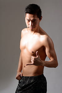 man standing while wearing gray and black bottom thumbnail