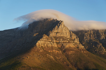 brown mountain covered with fog thumbnail