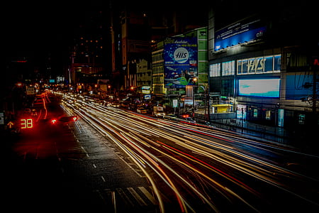 time-lapse photo of city road with buildings thumbnail