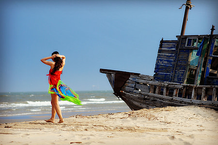 woman standing in front of beach thumbnail