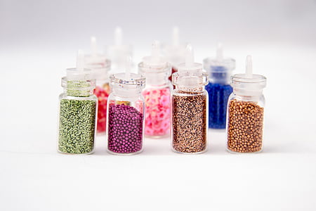 assorted glass bottles with glitter inside thumbnail