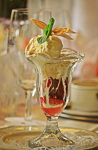 yellow ice cream on clear glass footed cup thumbnail