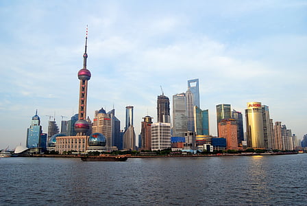 assorted buildings beside body of water thumbnail