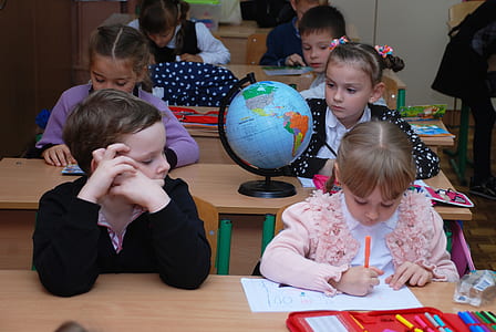 boy watching girl writing on notebook thumbnail