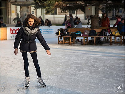 woman ice skating outdoors thumbnail