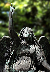 selective focus photography of gray angle statuette thumbnail
