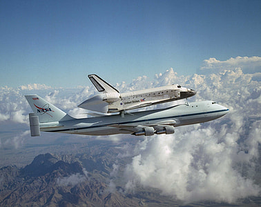 aerial photo of white NASA airplane thumbnail