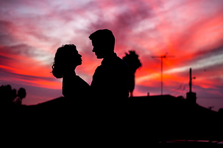silhouette photography of man and woman thumbnail