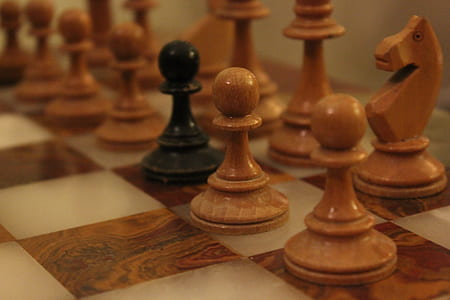 brown and black chess board set thumbnail