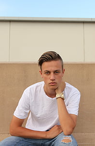 man wearing white crew-neck shirt and silver watch thumbnail