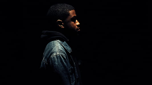 man standing on dark surface thumbnail