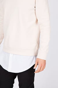 person in white sweater thumbnail