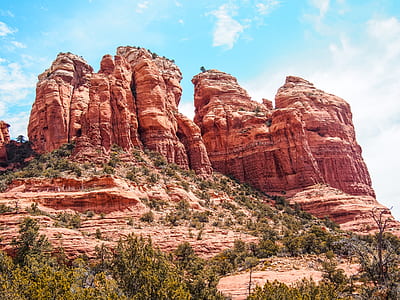 brown rock boulders under clear blue sky during daytime thumbnail