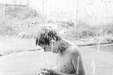 boy taking a bath outdoors thumbnail