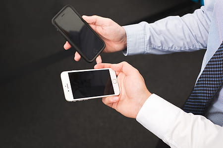 Businessmen Hold Blank iPhone Photo thumbnail