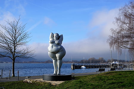 nude woman statue beside body of water photography thumbnail