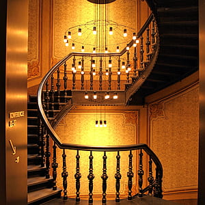 Brown Wooden Stairs and Chadelier thumbnail