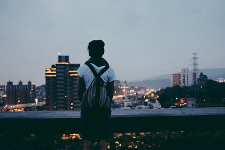 person wearing a black and gray backpack thumbnail