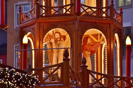 two angels blowing horns statues inside wooden tower thumbnail