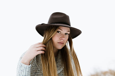 woman wearing brown sweater thumbnail