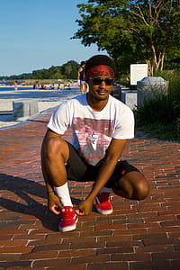 Man Wearing White T-Shirt And Black Shorts thumbnail