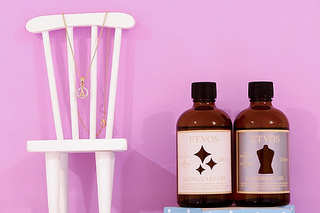 white wooden chair and two Etvos bottles thumbnail