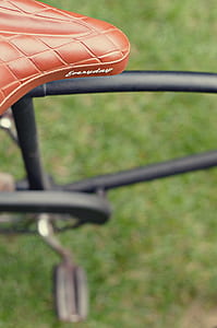 shallow focus of brown bicycle saddle thumbnail
